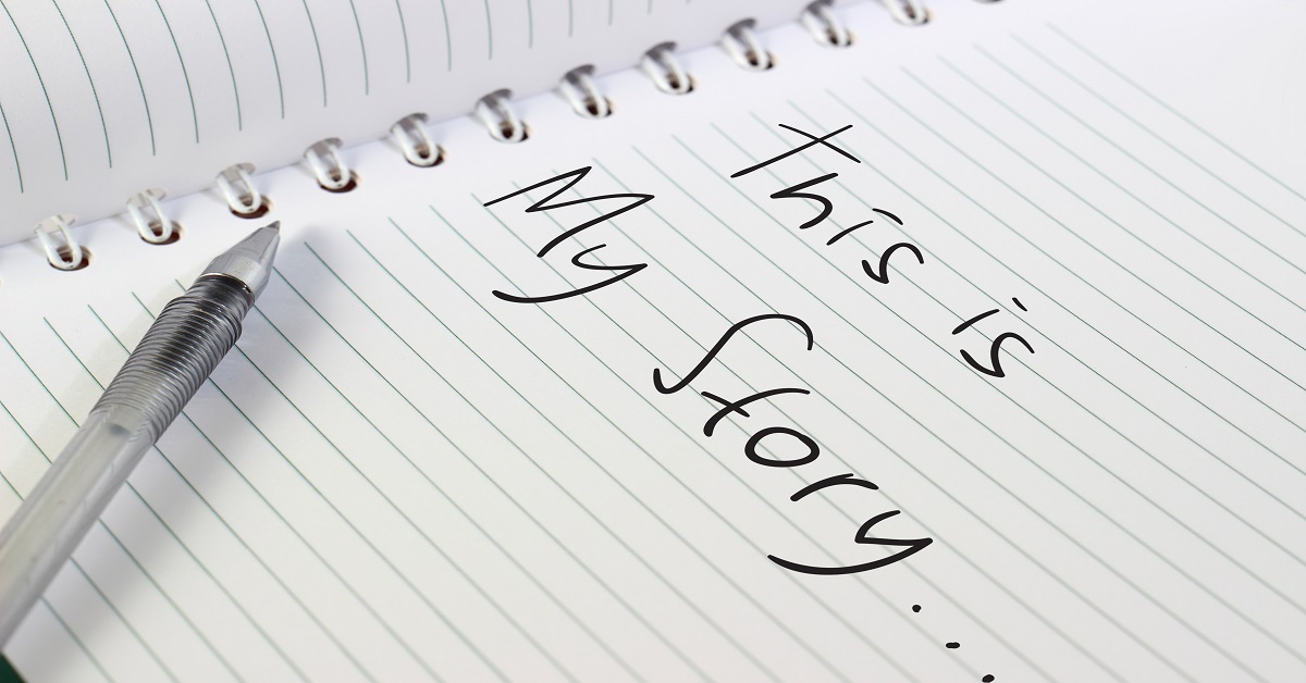 Image of opened white note book with a pen, and This Is My Story words written on it
